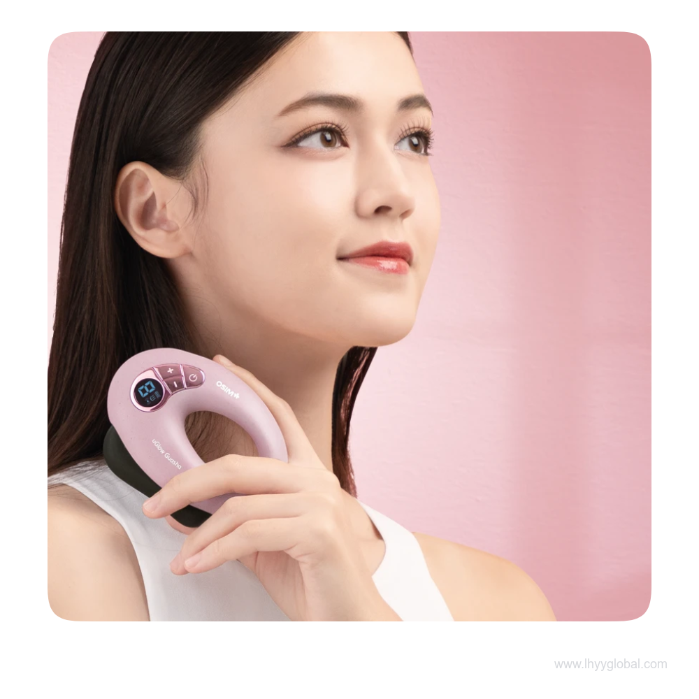 A woman holding the purple OSIM uGlow Guasha at the side of her neck.