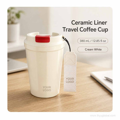 Custom logo 380 mL ceramic-lined stainless steel travel coffee cup in cream white with carry strap.