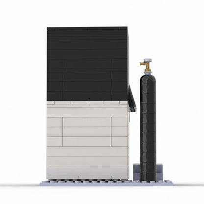Rear view of the PacBio Sequel IIe building block model showing its black-and-white body and cylinder accessory