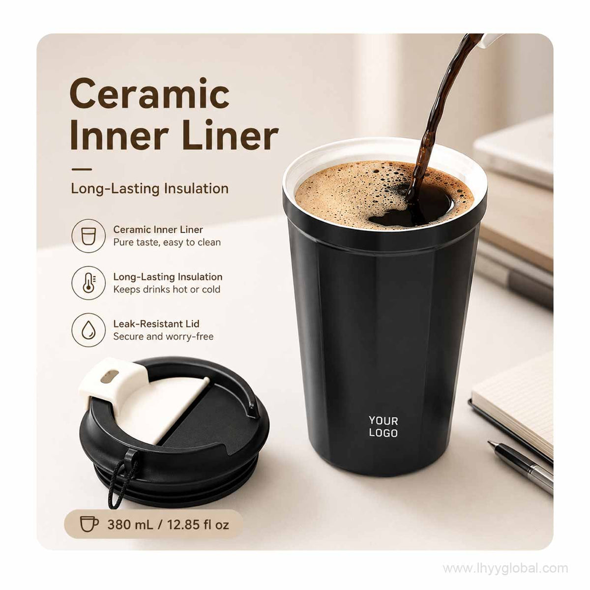 Black ceramic-lined vacuum insulated coffee cup with hot coffee being poured and lid shown beside it.