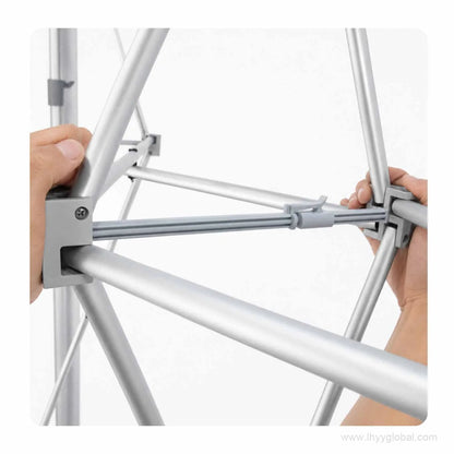 Hands connecting the support bar during tool-free assembly of a pop-up trade show display frame