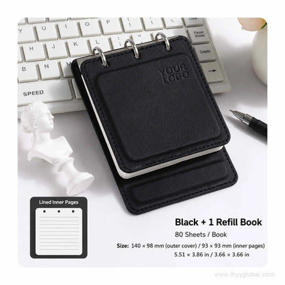 Black custom logo pocket loose-leaf notebook with 80-sheet lined refill book on an office desk.