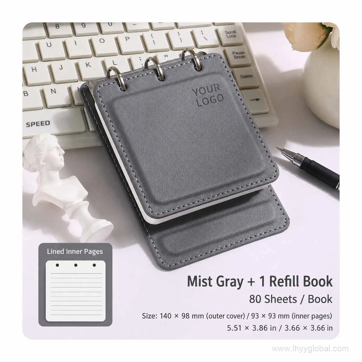 Mist Gray custom logo pocket loose-leaf notebook with 80-sheet lined refill book on an office desk.