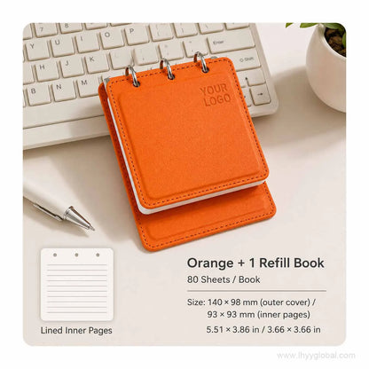 Orange custom logo pocket loose-leaf notebook with 80-sheet lined refill book on an office desk.