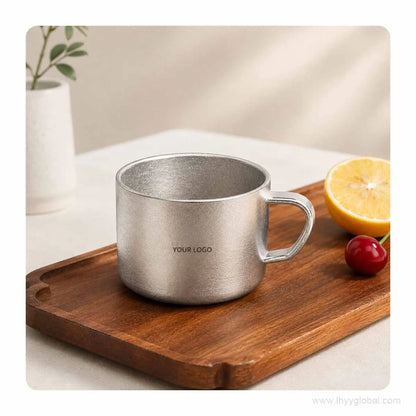 150 mL custom logo pure titanium cup with crystal finish on a wooden tray