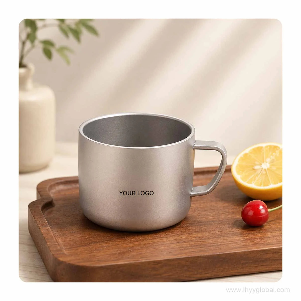 150 mL custom logo pure titanium cup with matte sand finish on a wooden tray
