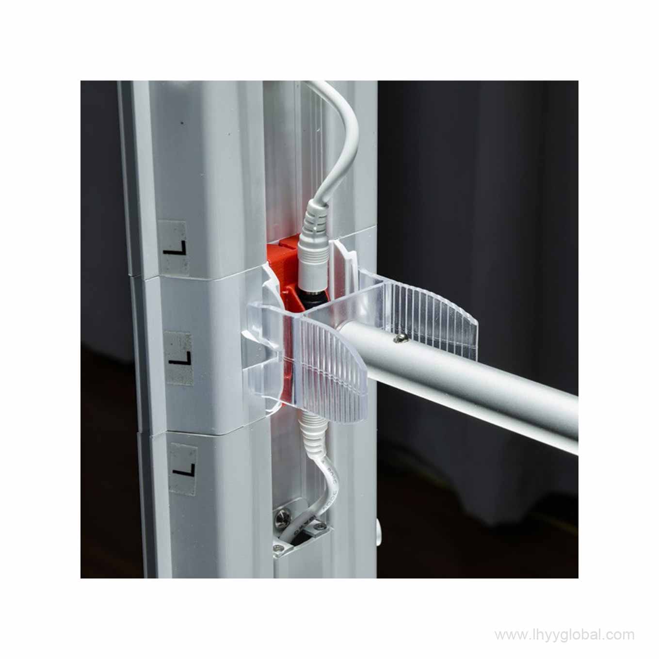 Hands connecting the modular SEG lightbox frame using the internal locking hardware.