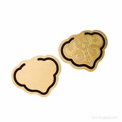 Decorative brass cloud ornament included in custom corporate gift set