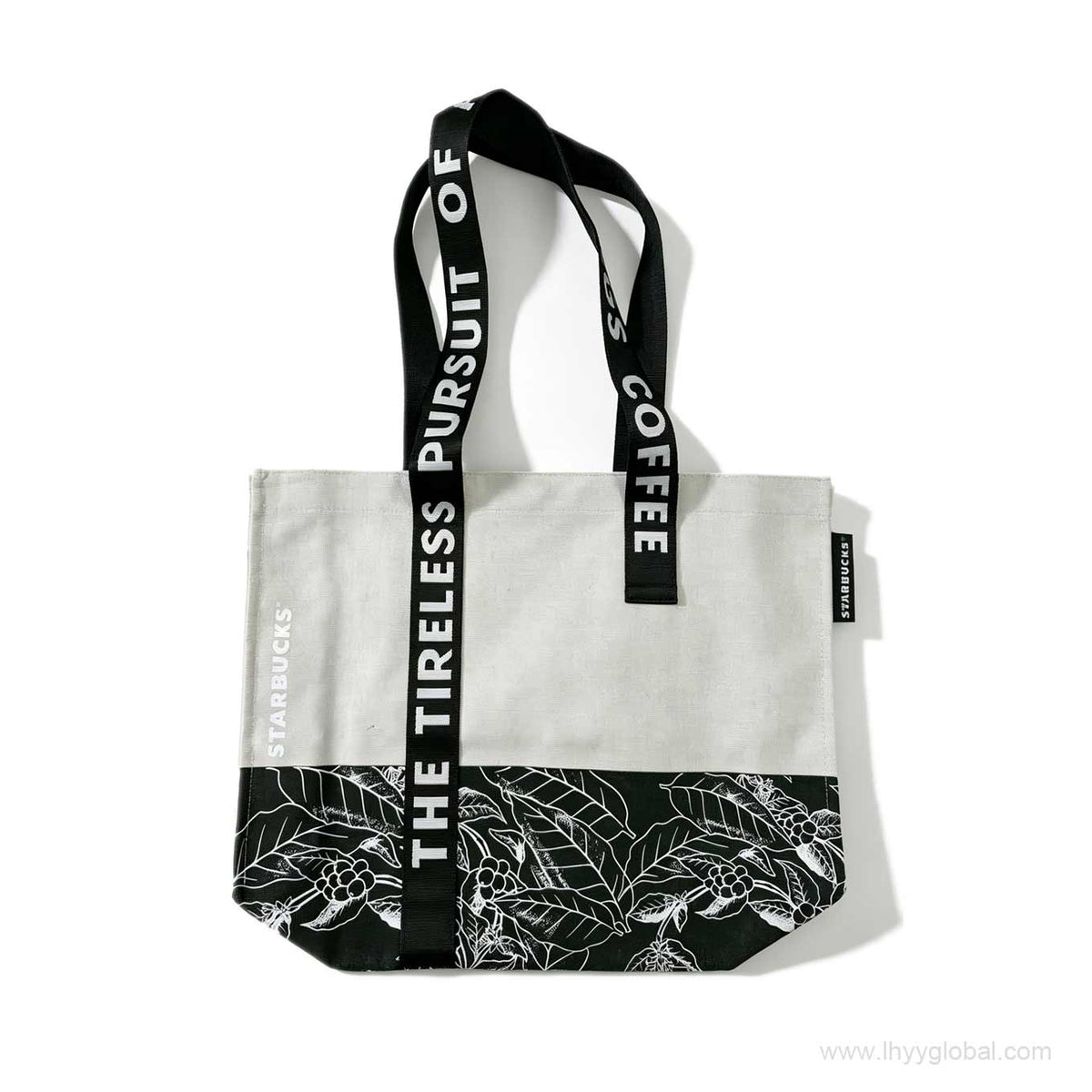 Custom white canvas tote bag with black handles and shoulder strap