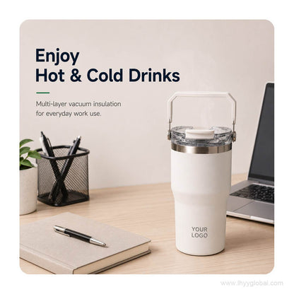 White vacuum insulated tumbler with portable handle shown on a professional office desk