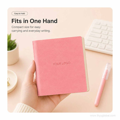 Peach Pink custom logo square pocket notebook held in one hand to show its compact size for everyday carrying.