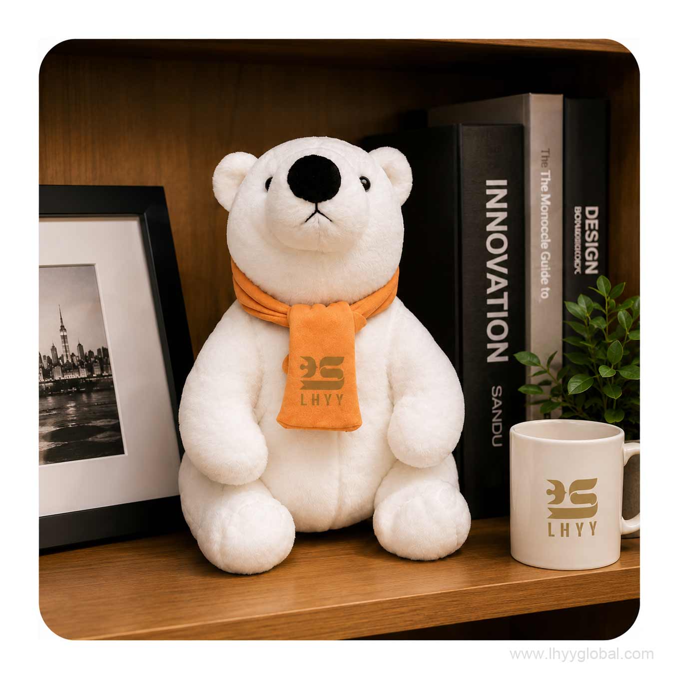 Custom polar bear plush toy with logo scarf displayed on a modern office shelf