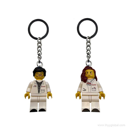 Premium Lego-compatible male scientist minifigure keychain with glasses, lab coat, and custom branding for biotech corporate gifting.