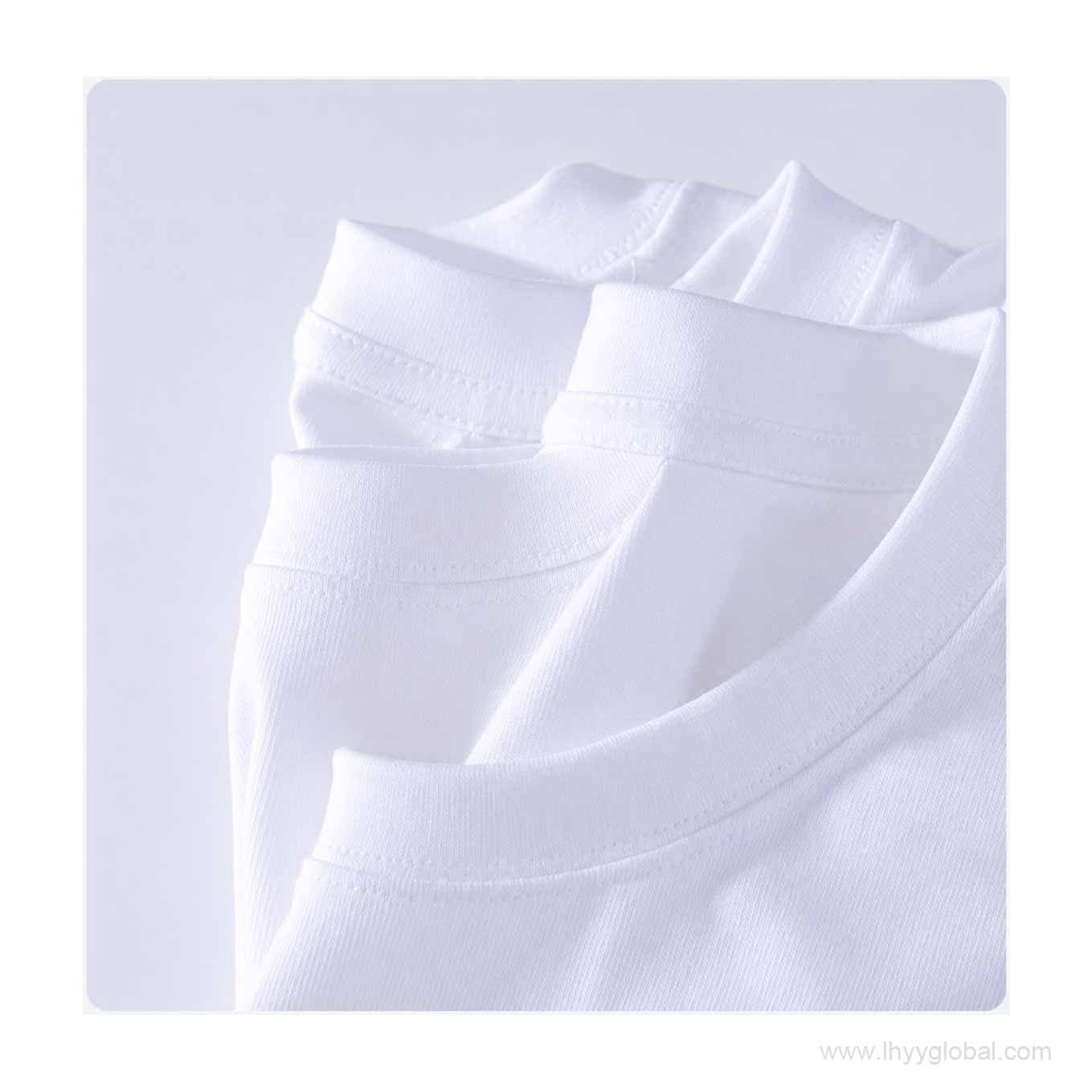 Multiple white short sleeve T-shirts showing crew neck collar construction