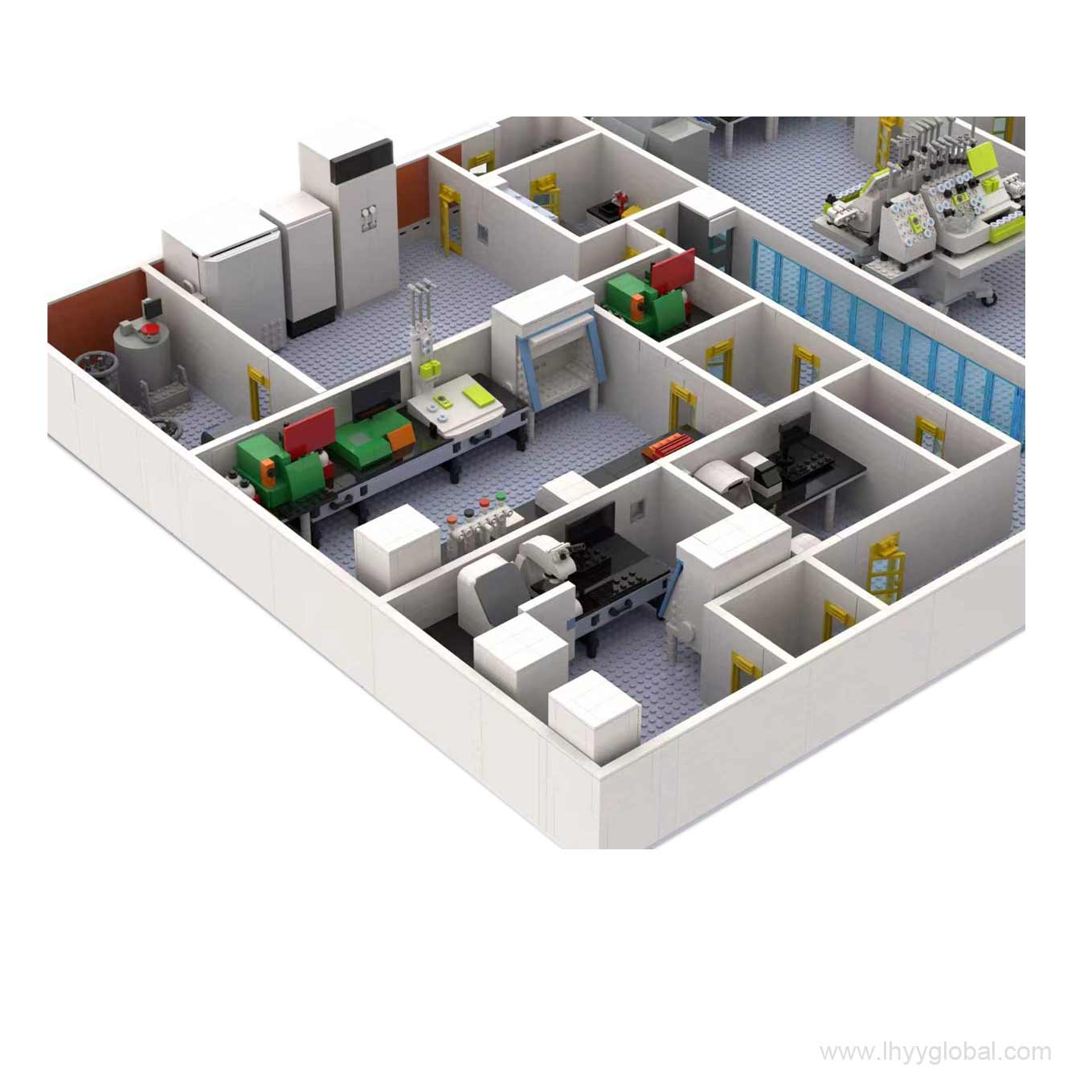 A close-up view of a custom Miltenyi Biotec laboratory station made from building blocks, highlighting the branded equipment, computer monitors, and modular shelving.