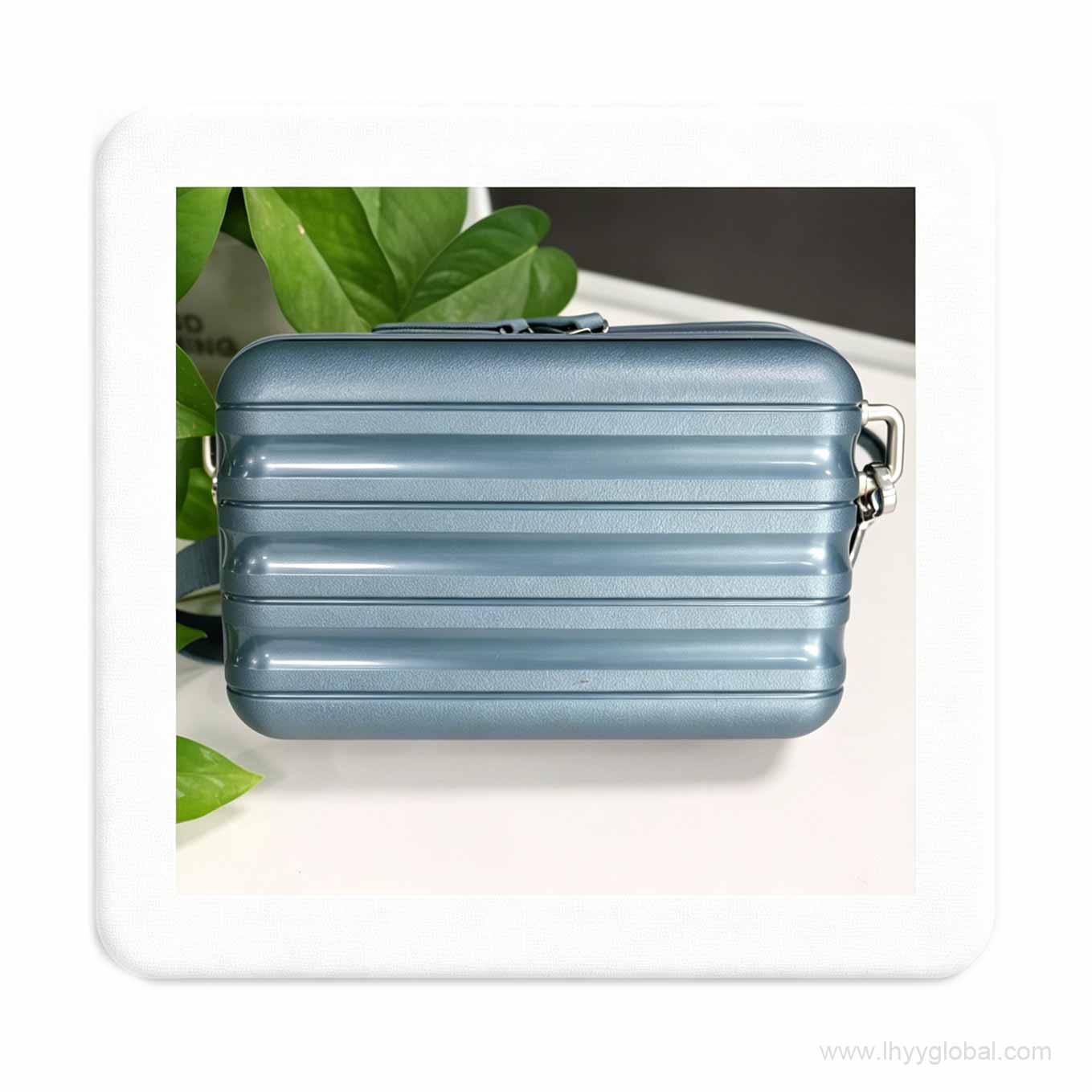 Light blue PP hard case displayed with indoor plants, showcasing its sleek aesthetic for life science executive gifts.