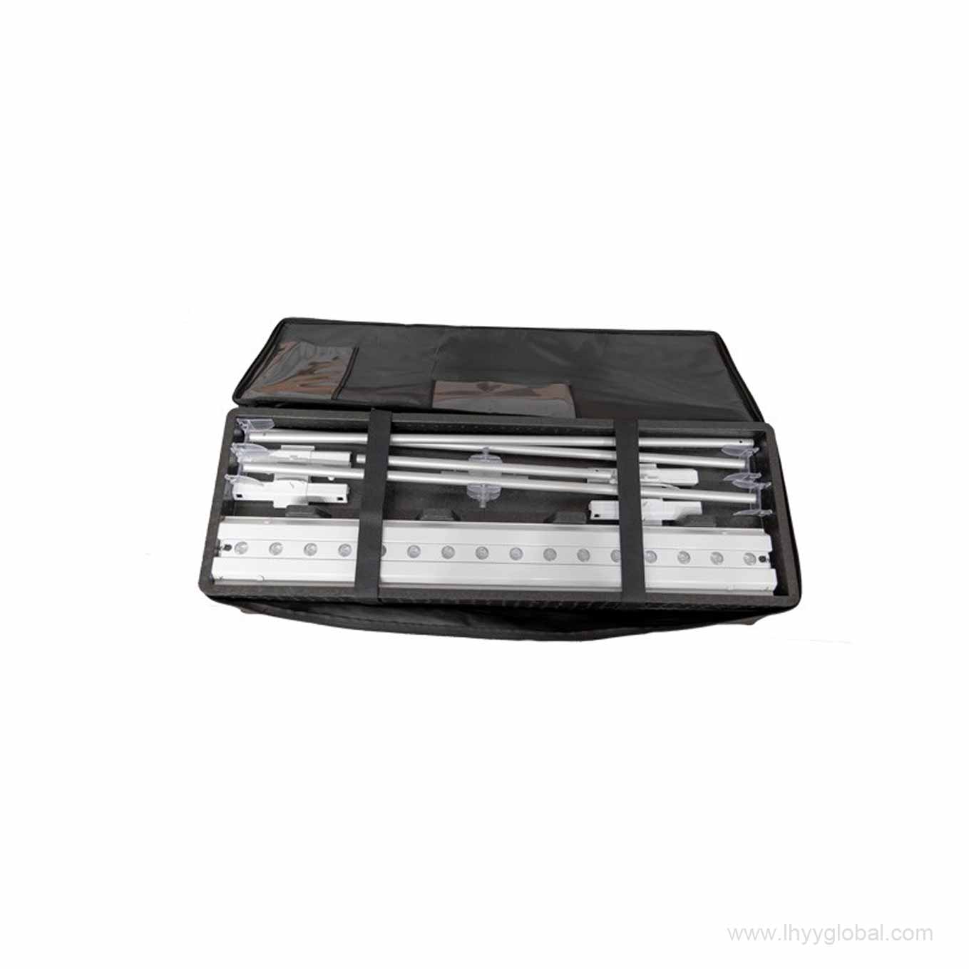 Open travel case showing the organized interior compartment with securing straps, designed to safely store the dismantled SEG lightbox aluminum profiles and connectors.