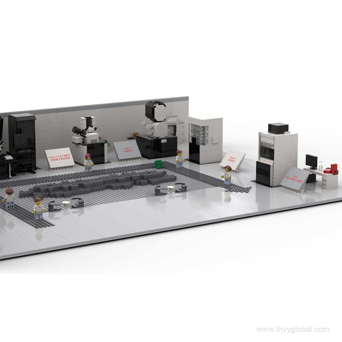 A detailed close-up of the control room in the Thermo Fisher Cryo-EM laboratory building block set, featuring two scientist minifigures seated at workstations with multiple monitors displaying simulated scientific data.