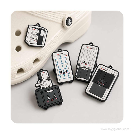 Custom Thermo Fisher instrument shoe charms displayed on white perforated clogs