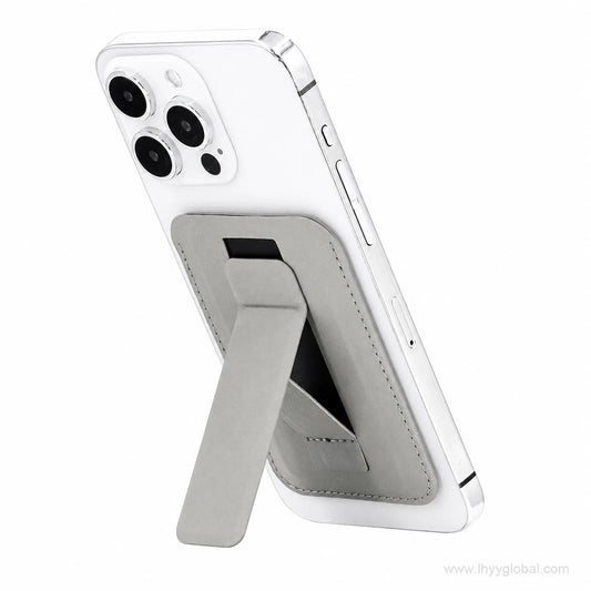 Gray magnetic phone wallet card holder with fold-out stand supporting a smartphone in portrait orientation